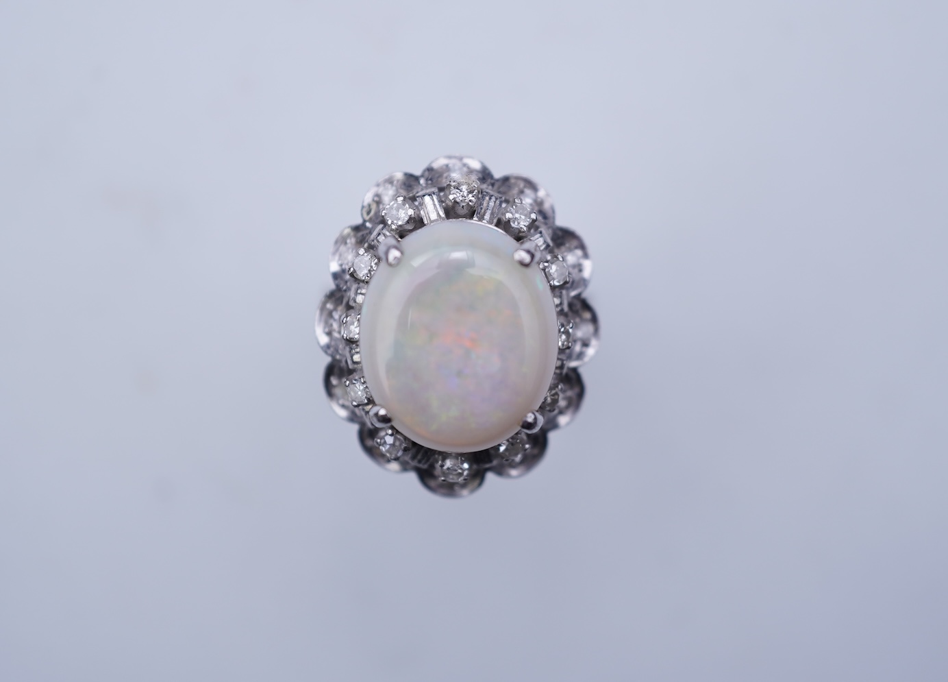 An opal and diamond cluster ring